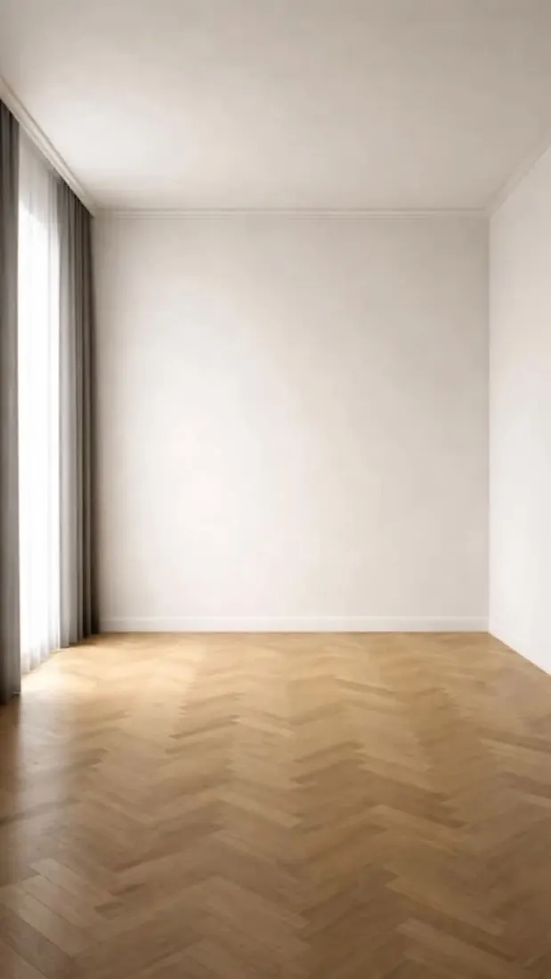 La pièce test vide : murs blancs, grande fenêtre et parquet en chevrons